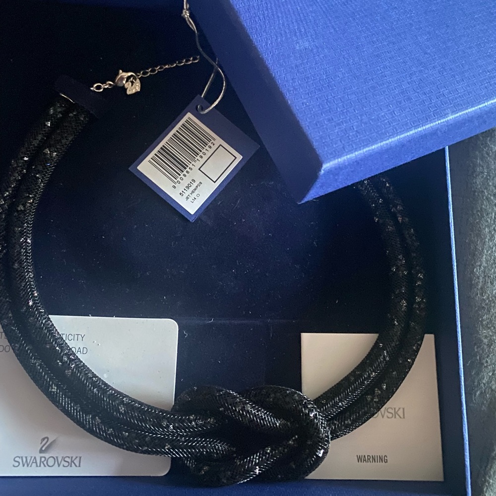 Never worn, black crystal Swarovski knot necklace
